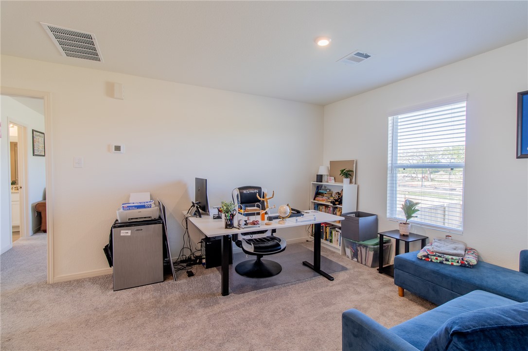 6029 Toby Bend Bryan, TX 77807 - Photo 19 of 25 a view of a livingroom with workspace and a couch