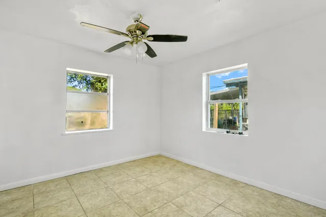 a view of empty room with windows