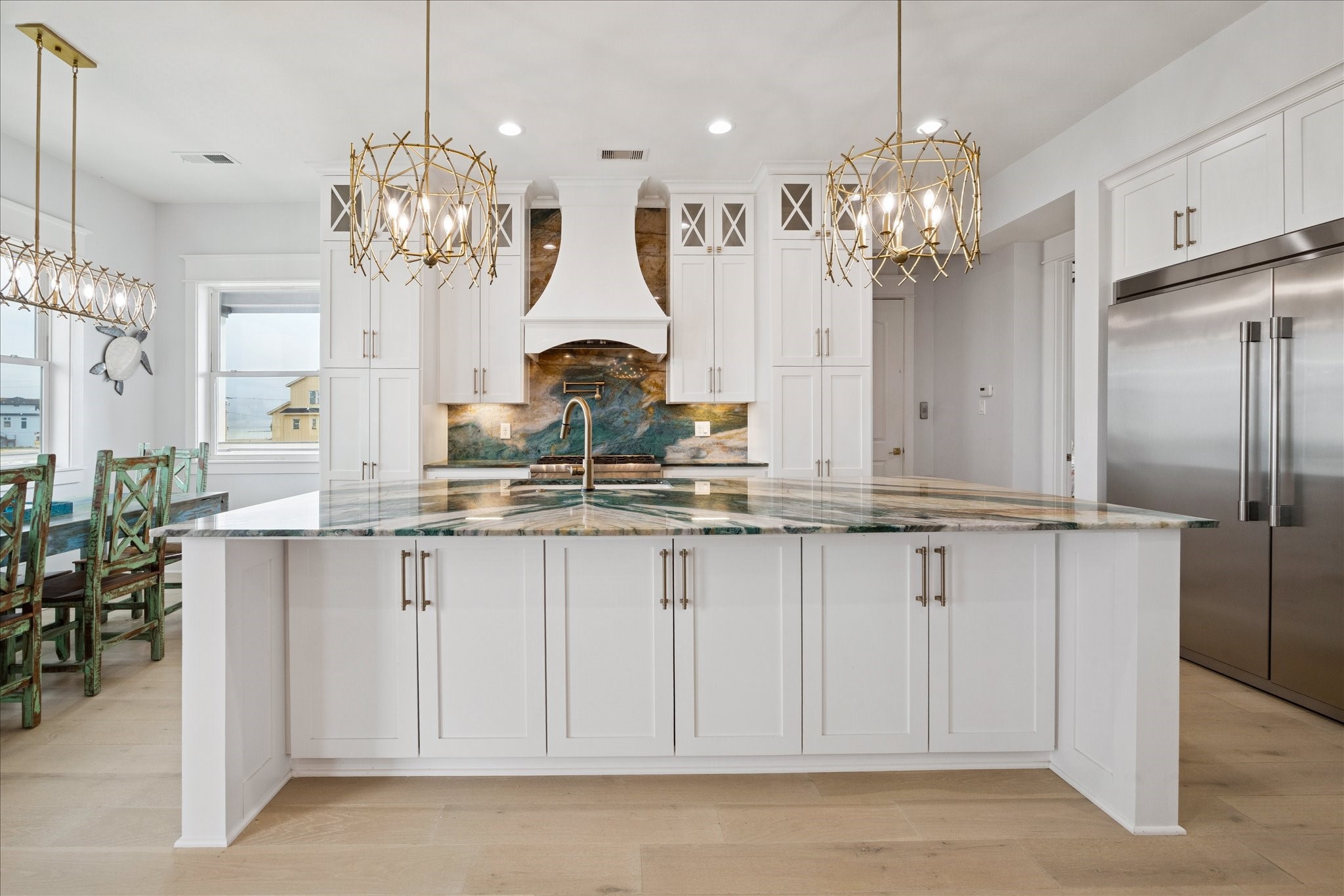 5 Loggerhead Hitchcock, TX 77563 - Photo 11 of 50 a view of a kitchen with granite countertop stainless steel appliances a chandelier and a counter space