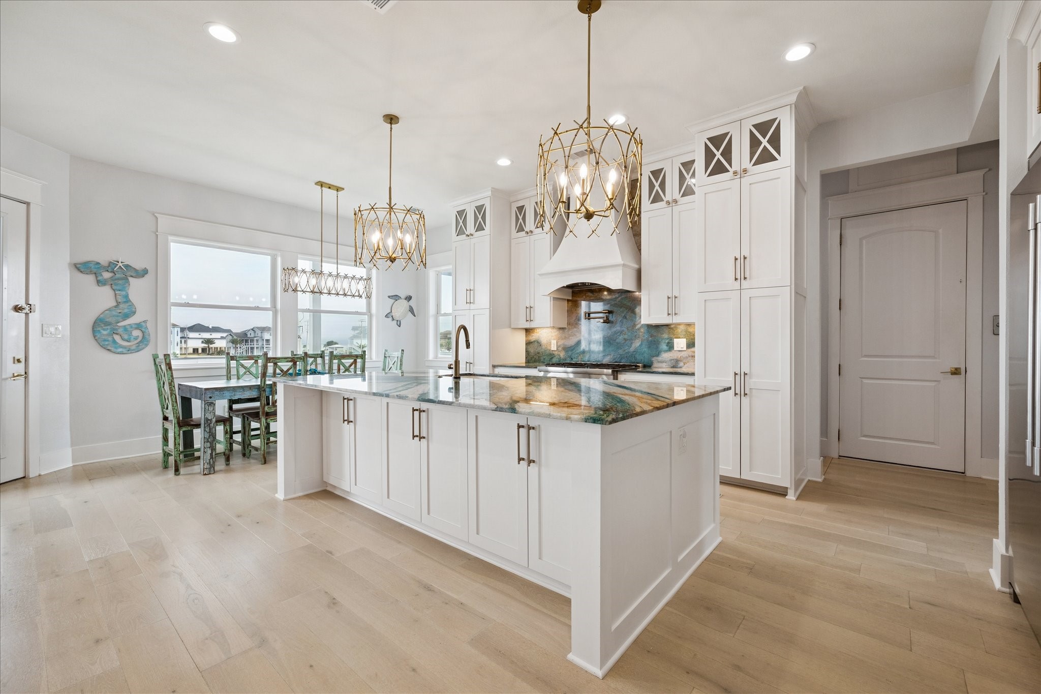 5 Loggerhead Hitchcock, TX 77563 - Photo 12 of 50 a large kitchen with kitchen island a chandelier and refrigerator