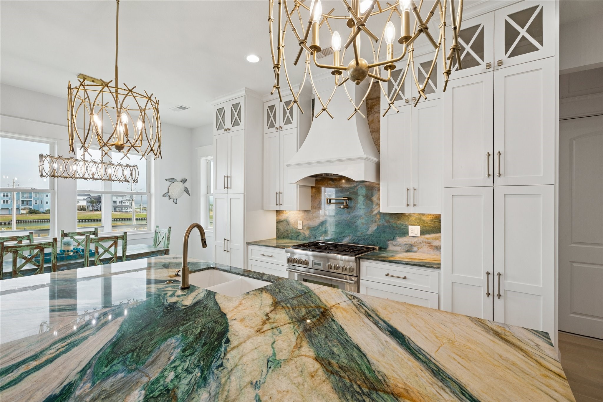 5 Loggerhead Hitchcock, TX 77563 - Photo 15 of 50 a kitchen with stainless steel appliances kitchen island granite countertop a stove a sink and a white cabinets