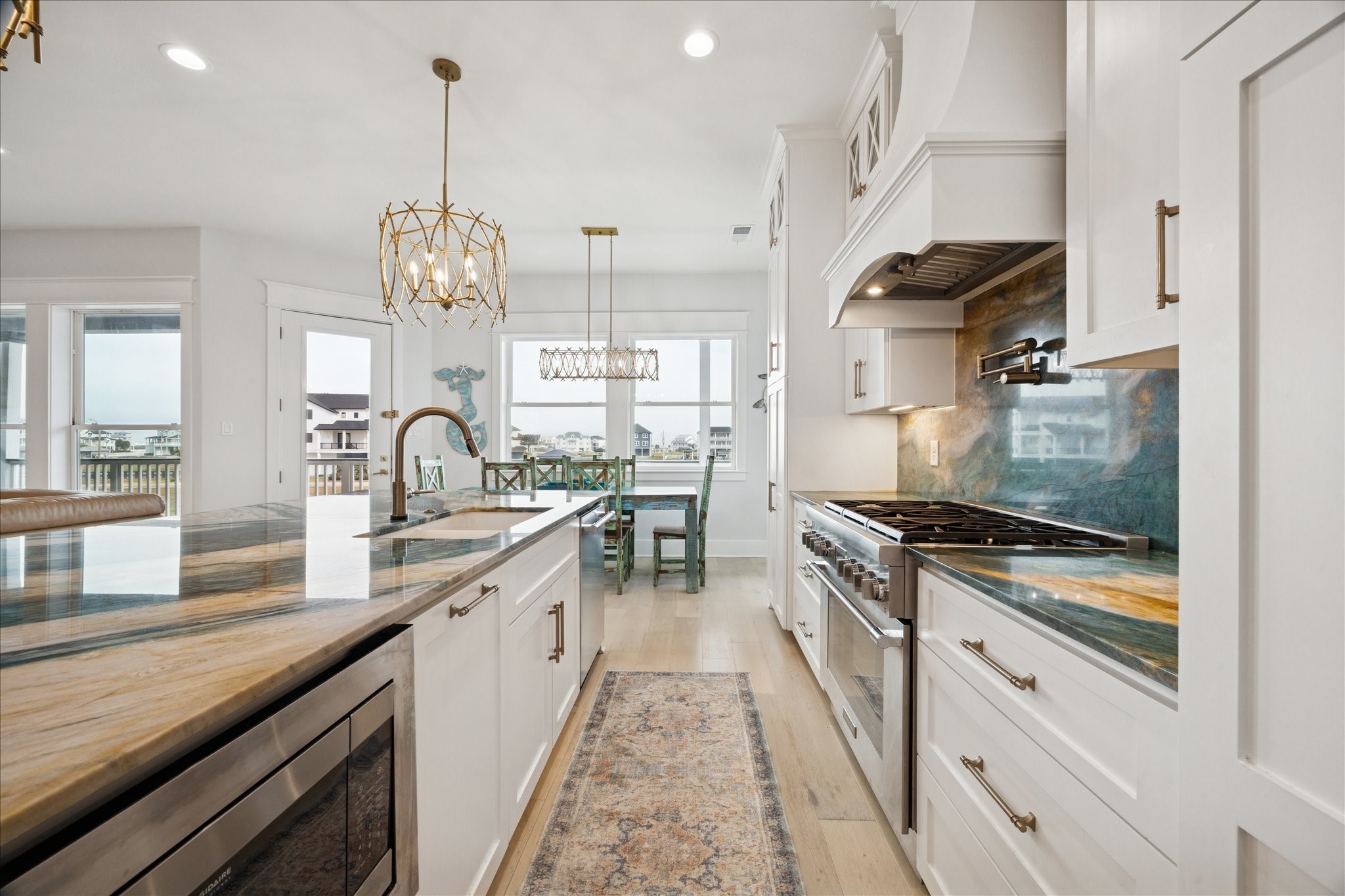 5 Loggerhead Hitchcock, TX 77563 - Photo 18 of 50 a kitchen with granite countertop a sink stove and cabinets