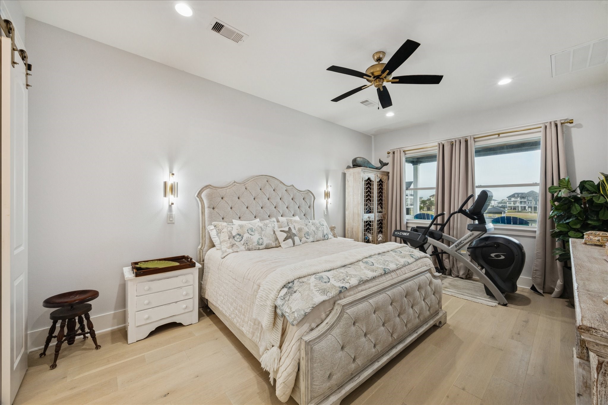 5 Loggerhead Hitchcock, TX 77563 - Photo 21 of 50 a bedroom with a bed and a chandelier