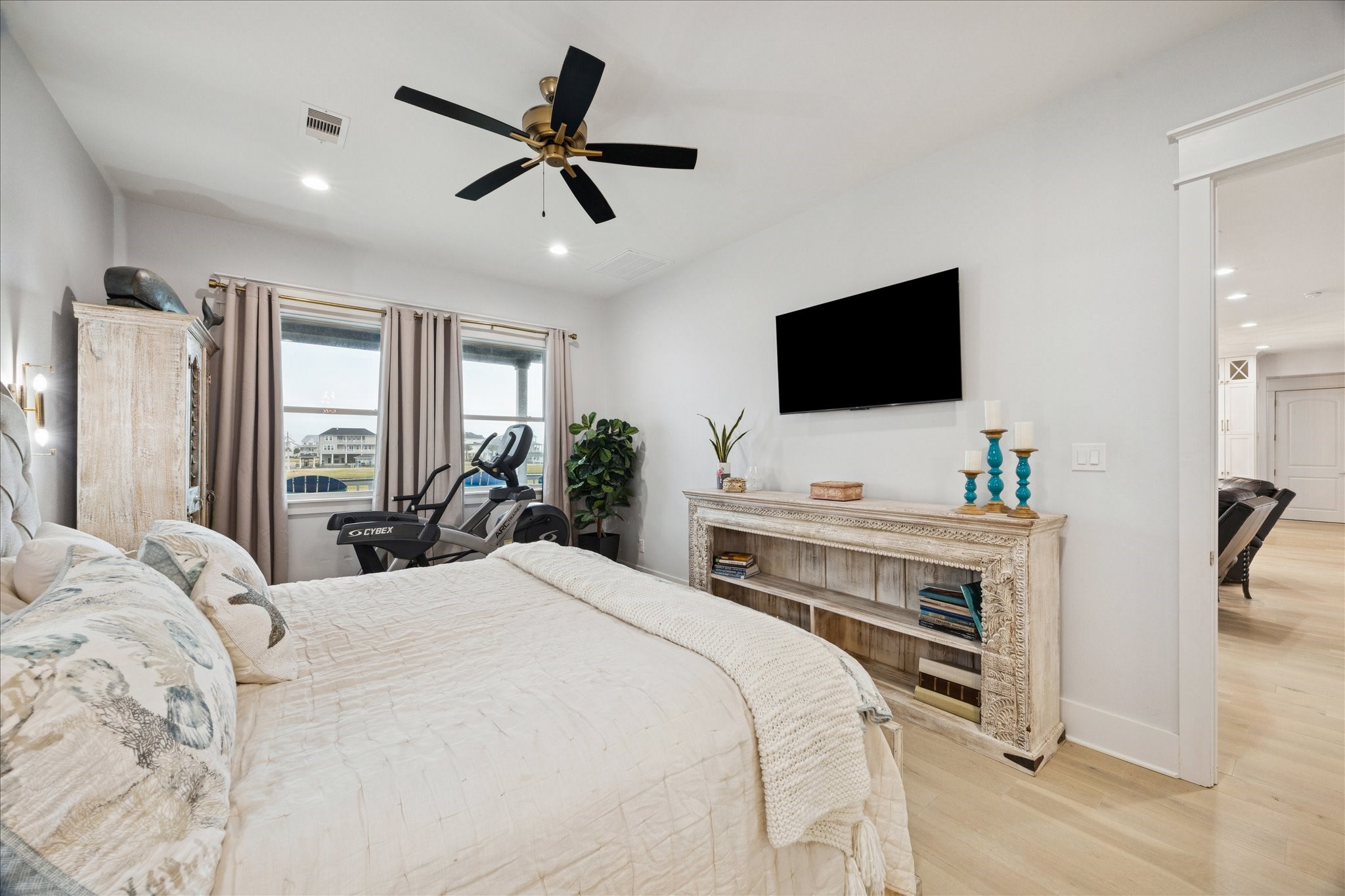 5 Loggerhead Hitchcock, TX 77563 - Photo 22 of 50 a bedroom with a bed a large window and a flat screen television