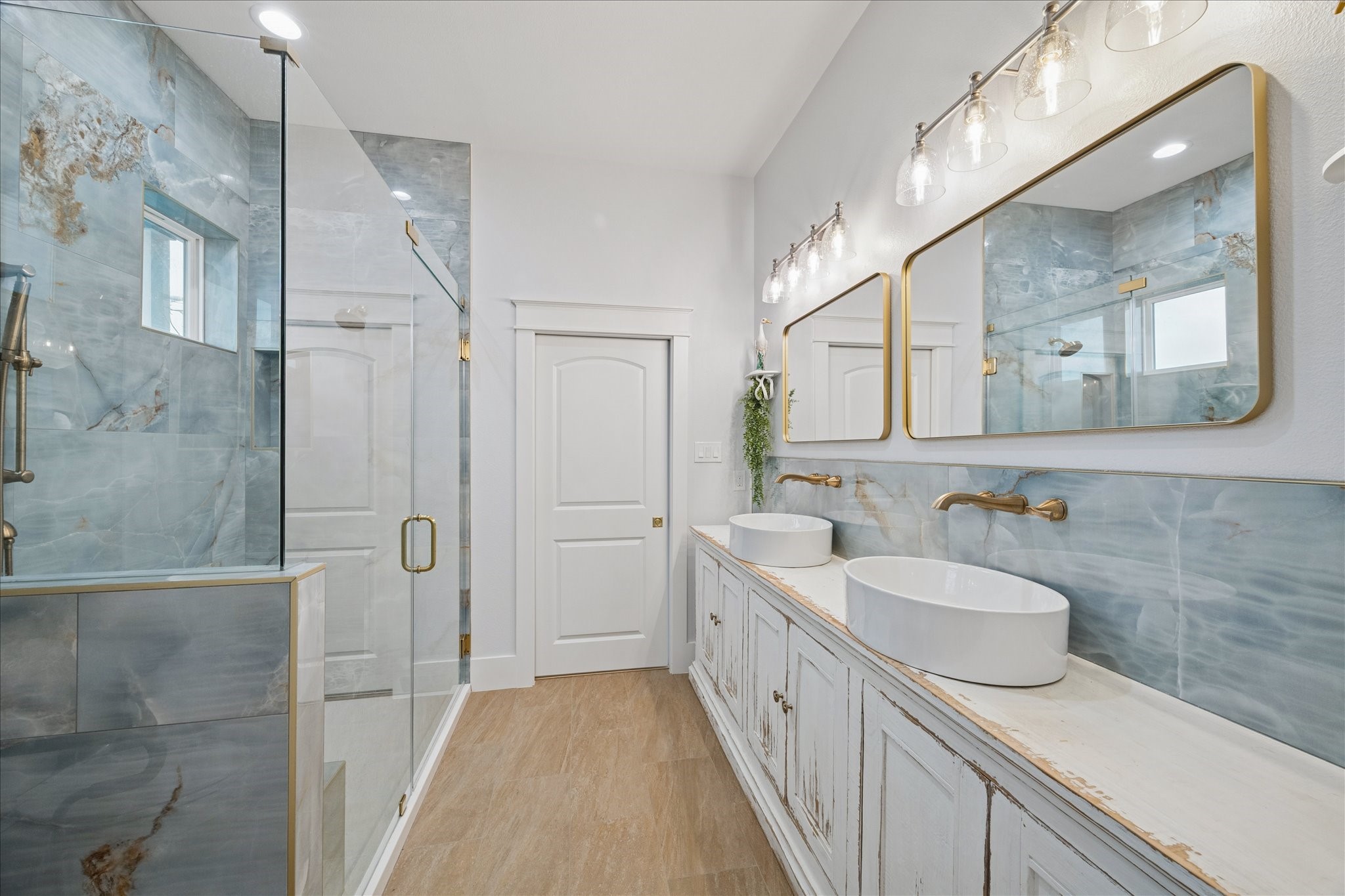5 Loggerhead Hitchcock, TX 77563 - Photo 29 of 50 a bathroom with a double vanity sink mirror and shower