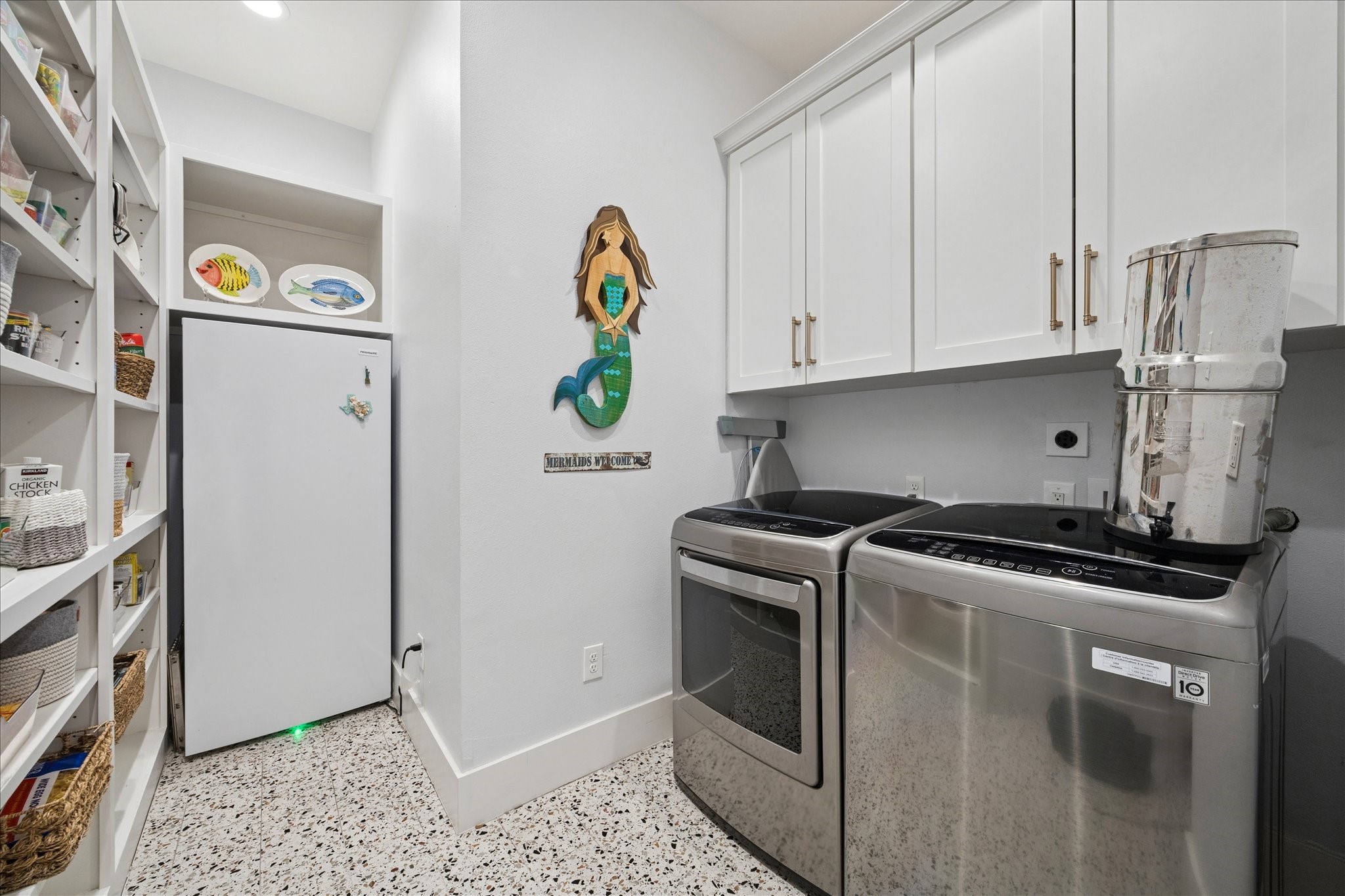 5 Loggerhead Hitchcock, TX 77563 - Photo 33 of 50 a kitchen with stainless steel appliances granite countertop a refrigerator and a stove