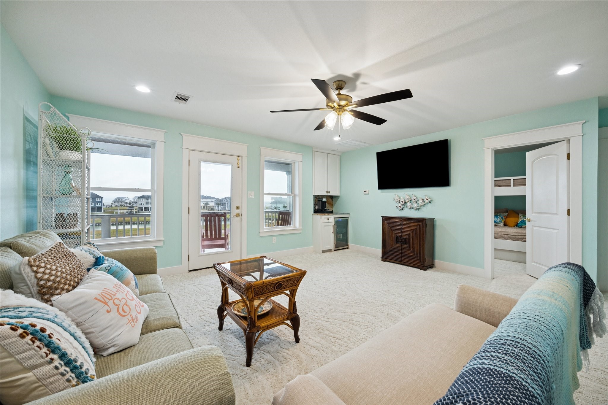 5 Loggerhead Hitchcock, TX 77563 - Photo 36 of 50 a living room with furniture a fireplace and a flat screen tv