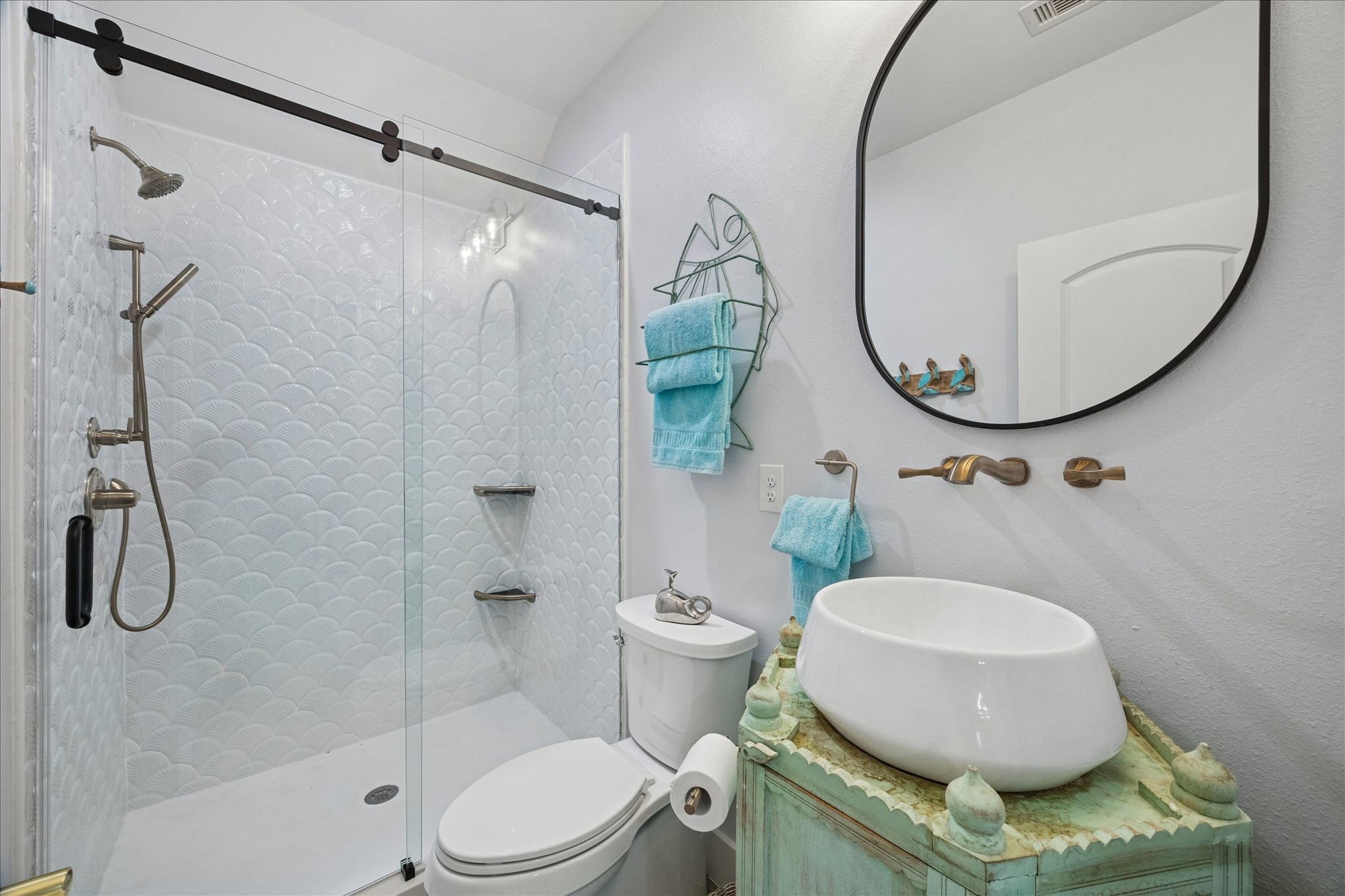 5 Loggerhead Hitchcock, TX 77563 - Photo 40 of 50 a bathroom with a toilet a sink and a mirror