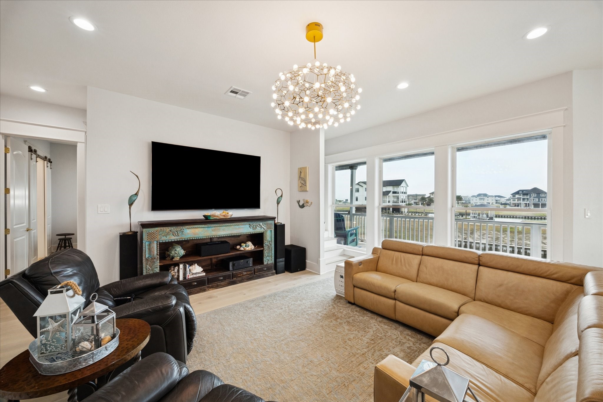 5 Loggerhead Hitchcock, TX 77563 - Photo 8 of 50 a living room with furniture a flat screen tv and a large window