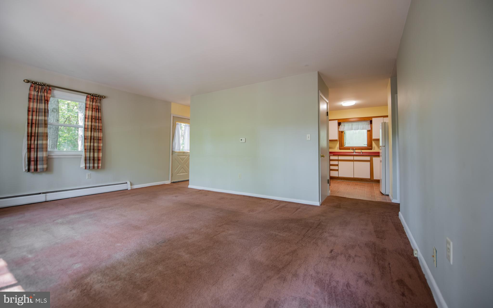 428 Hubler Ridge Road Howard, PA 16841 - Photo 10 of 19 an empty room with windows and entrance