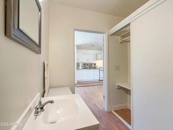 a bathroom with a sink and a mirror