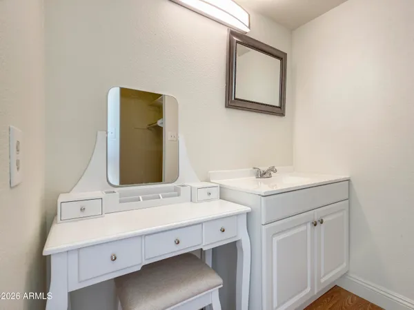 a bathroom with a double vanity sink and mirror