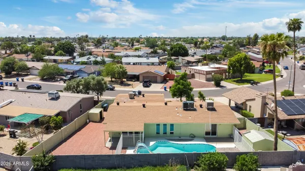 an aerial view of a house with a garden