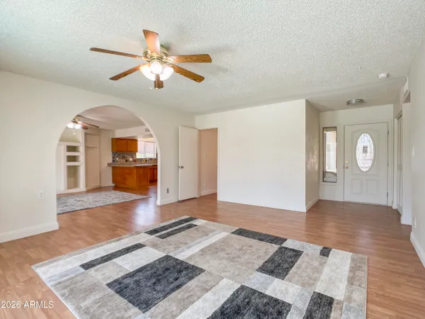 a view of livingroom with hardwood floor and ceiling fan