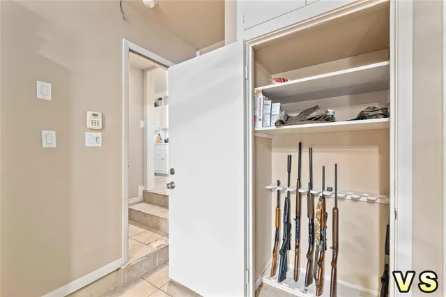 a view of closet with wooden floor