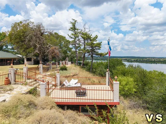 a view of a chair and table in the patio