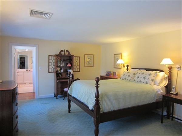 19 Southgate Road Wellesley, MA 02482 - Photo 7 of 14 a bedroom with a bed and a table in it