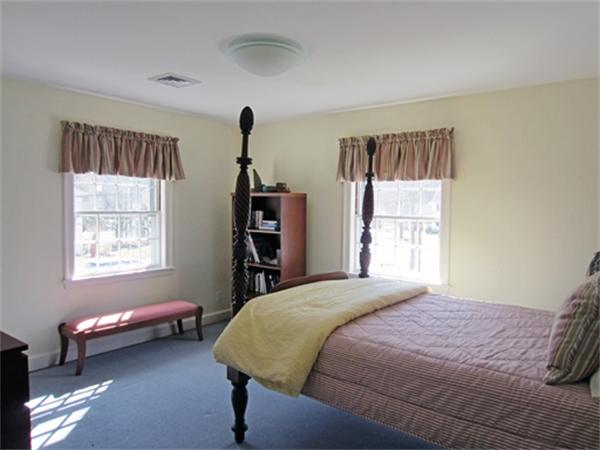 19 Southgate Road Wellesley, MA 02482 - Photo 9 of 14 a bedroom with a bed and a window