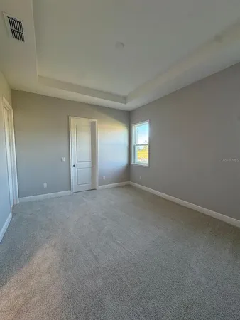 a view of an empty room with windows