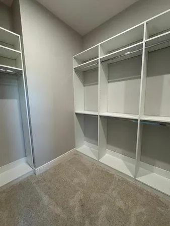 a view of an empty walk in closet