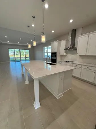 a view of room that has a ceiling fan and window