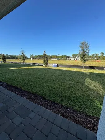 a view of a lake with a big yard