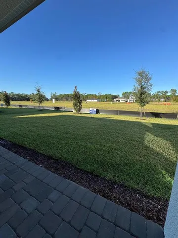 a view of a lake with a big yard