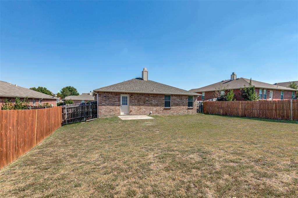 2613 Salt Maker Way Little Elm, TX 75068 - Photo 14 of 16 a front view of a house with a yard