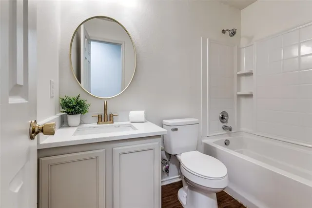 a bathroom with a sink toilet and a bathtub