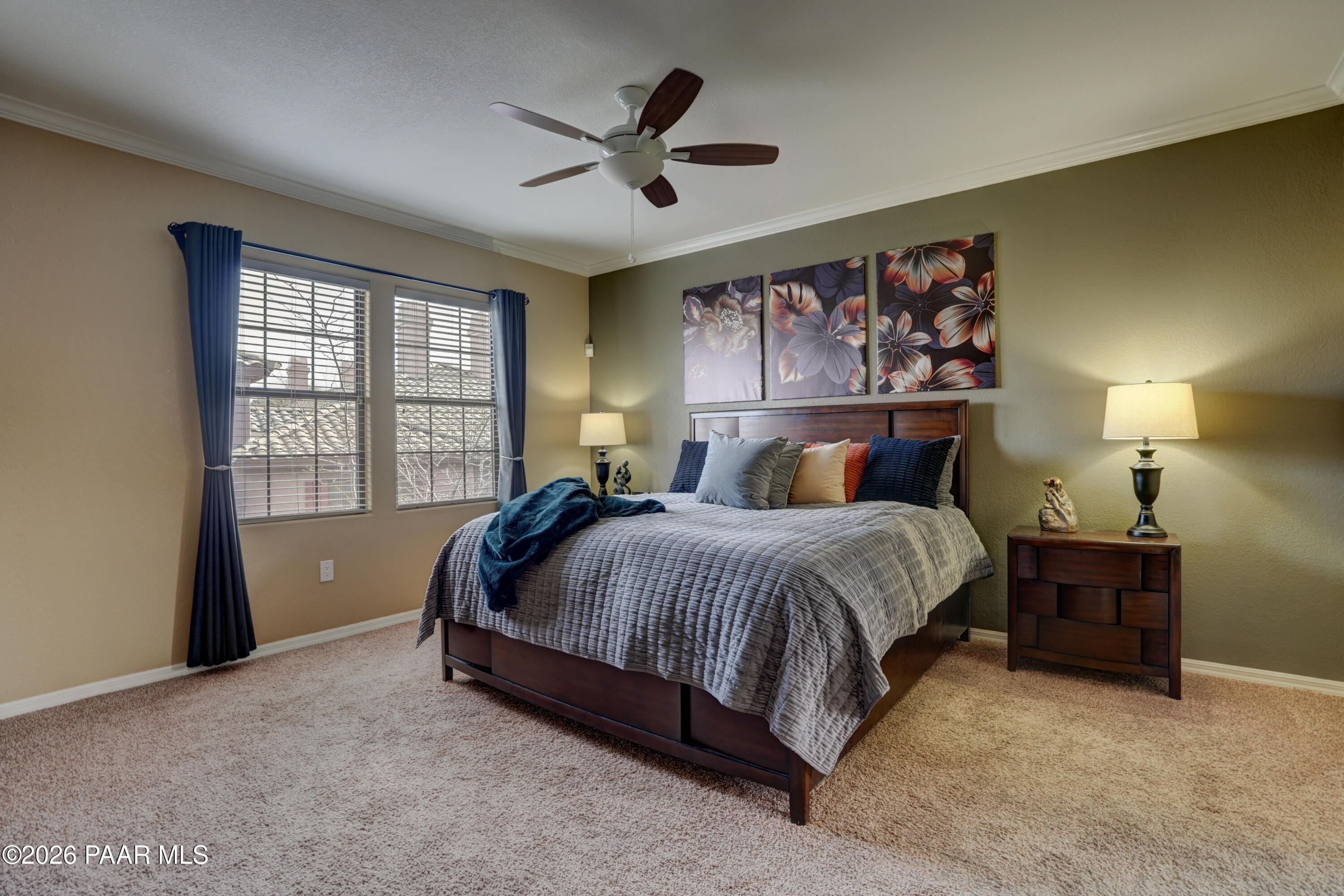 1716 Alpine Meadows Lane, Unit 405 Prescott, AZ 86303 - Photo 19 of 29 a bed sitting in a spacious bedroom next to a window