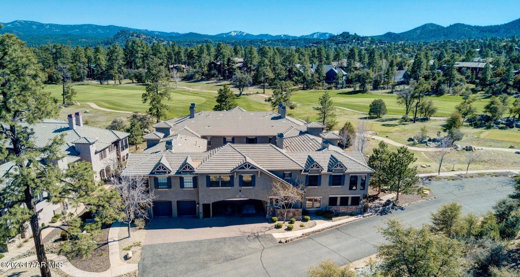 1716 Alpine Meadows Lane, Unit 405 Prescott, AZ 86303 - Photo 3 of 29 a aerial view of a house with swimming pool and a yard