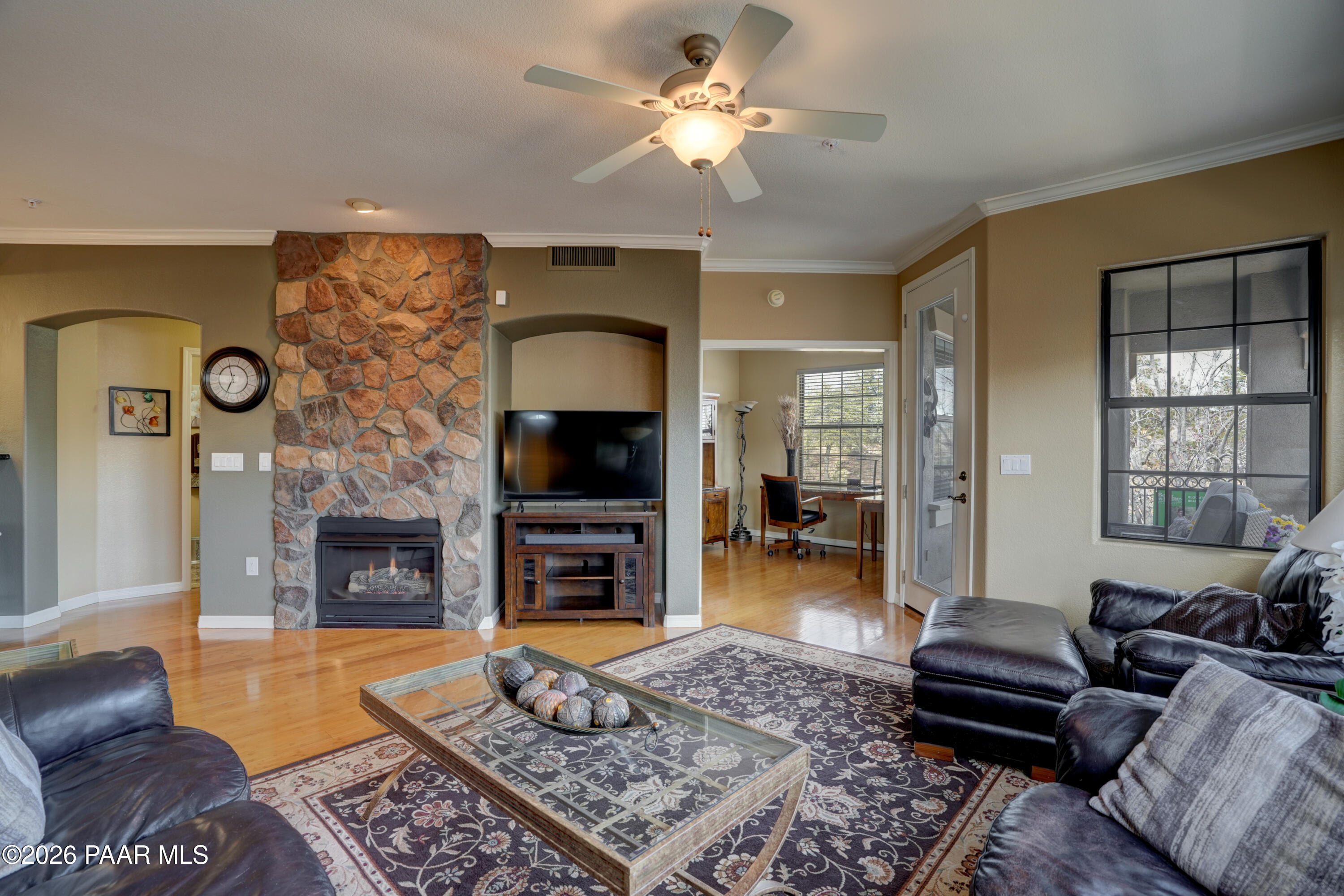1716 Alpine Meadows Lane, Unit 405 Prescott, AZ 86303 - Photo 8 of 29 a living room with furniture and a fireplace