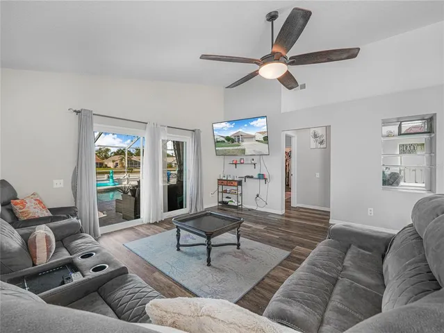 a living room with furniture and a large window