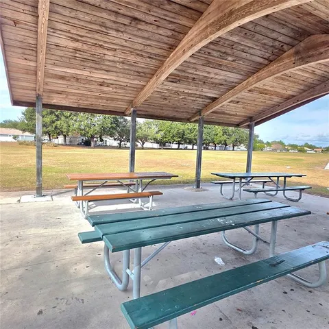 a view of swimming pool with outdoor seating