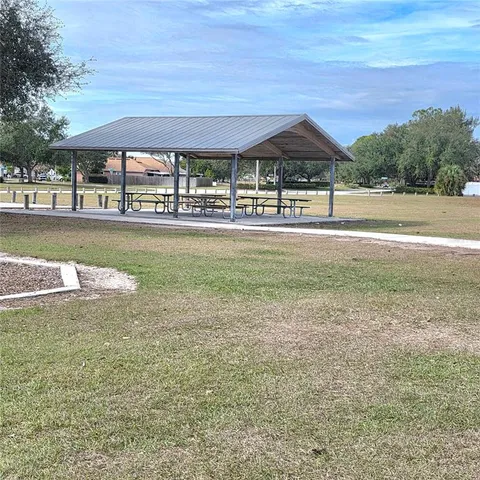 a view of a swimming pool with a yard