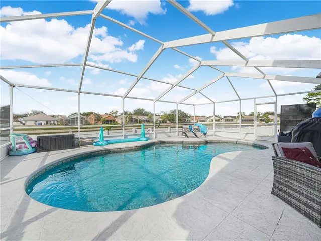 a view of a swimming pool with a porch