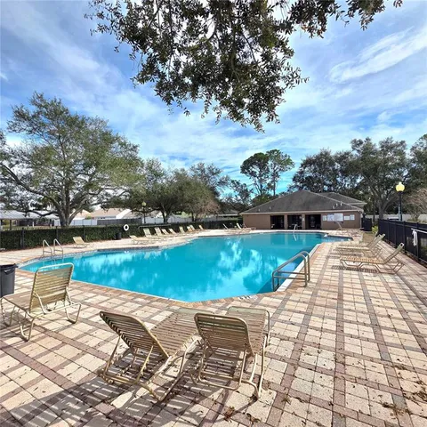 a view of a yard with swings and slides
