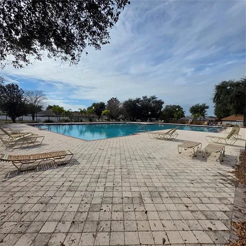 an aerial view of a house with garden space and street view