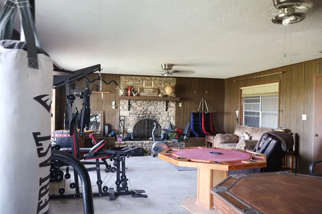 a front view of house with a garden and trees