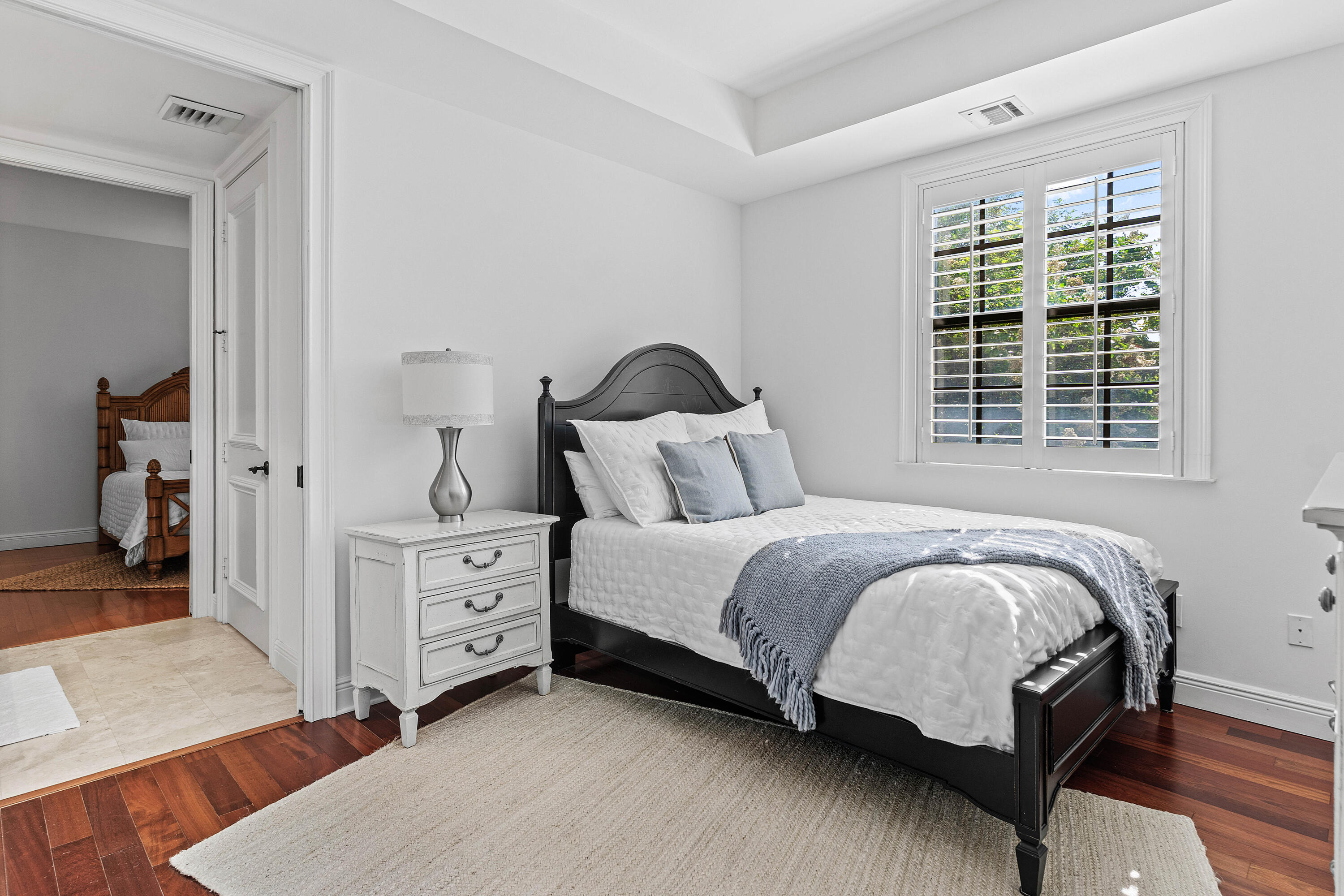 110 Gleason Street, Unit 203 Delray Beach, FL 33483 - Photo 20 of 25 a bedroom with a bed and a window