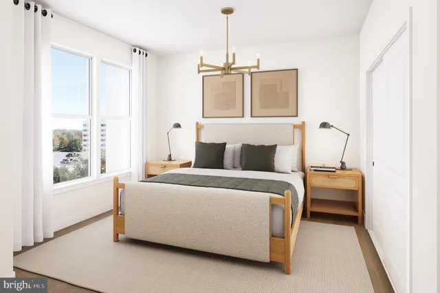 a view of walk in closet with clothes