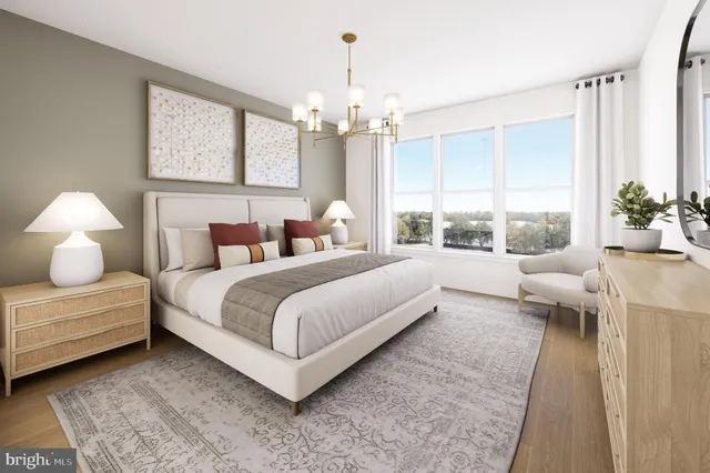 a living room with furniture and a lamp