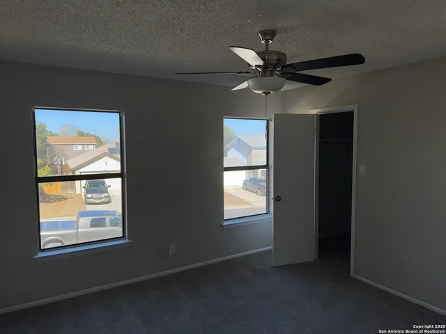 a view of an empty room with a window