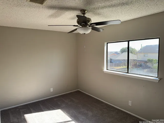 a white toilet sitting next to a bath tub