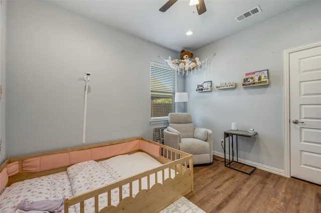 a living room with a couch and a chandelier