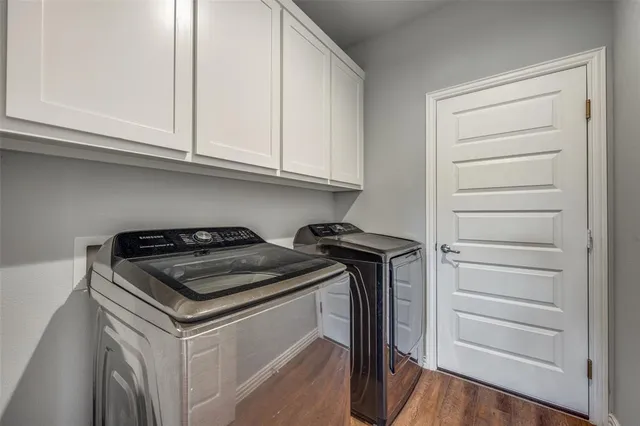 a view of workspace with wooden floor windows