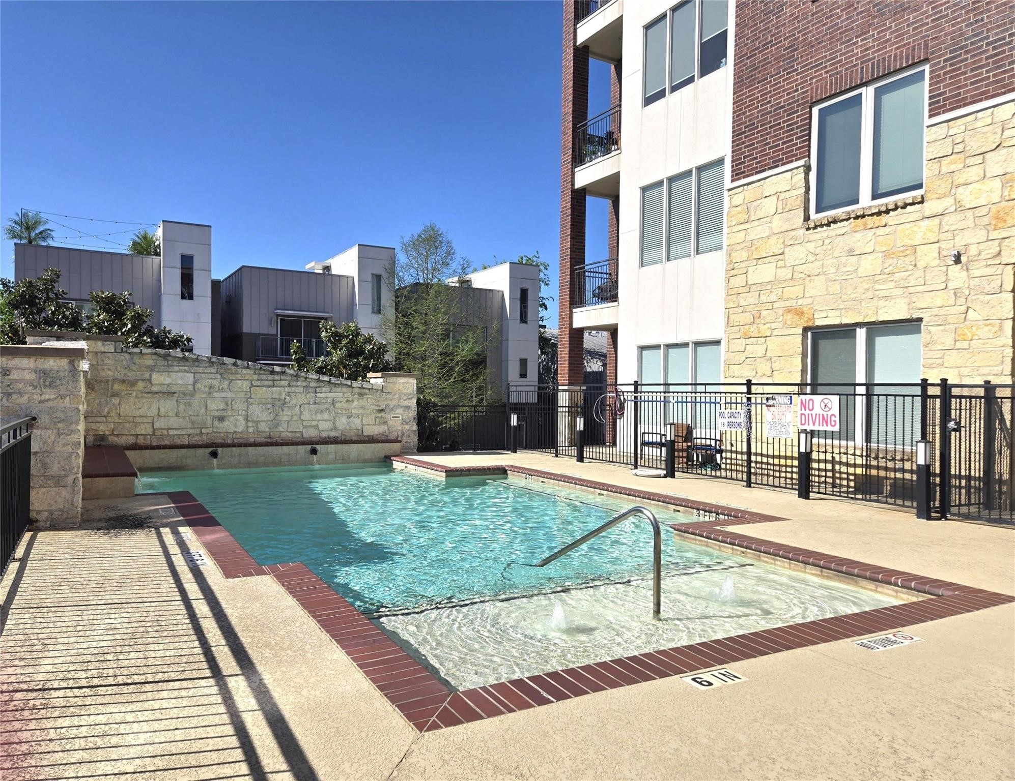 1900 Genesee Street, Unit 207 Houston, TX 77006 - Photo 43 of 50 Sparkling pool with water feature and great views of Downtown Houston.
