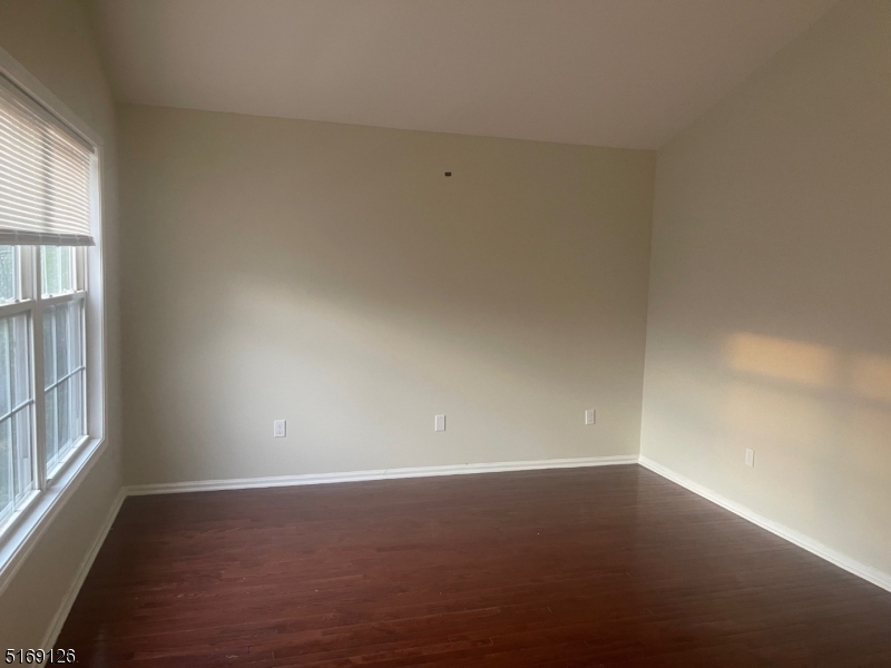 406 South 7th Street, Unit 2 Newark, NJ 07103 - Photo 2 of 9 an empty room with a window