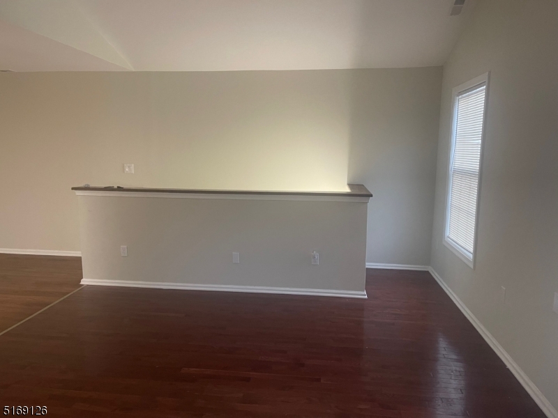 406 South 7th Street, Unit 2 Newark, NJ 07103 - Photo 3 of 9 an empty room with wooden floor