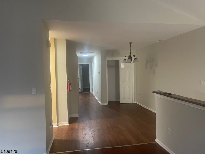 406 South 7th Street, Unit 2 Newark, NJ 07103 - Photo 4 of 9 a view of a hallway with wooden floor